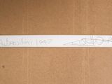 a picture of a sign on a cardboard box with writing on it
