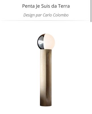 the lamp is made of wood and has a glass ball on it