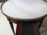 a marble top coffee table with a wooden base