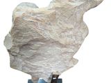 sculpture of a rock on a metal stand with a white background