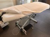 a table with a sheet on top of it in a room