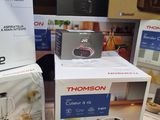 three boxes of kitchen appliances sitting on a table