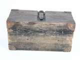 an old wooden box with a metal latch on it