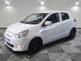 a picture of a white car parked in a garage