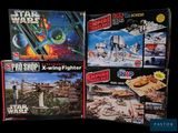 several star wars action toys are on display in a display case