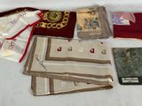 many different types of cloths laid out on a table