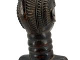 statue of a woman with a hat on top of her head