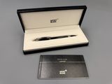 a black box with a pen and a notepad in it