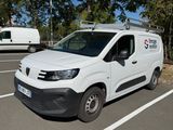 a white van that is parked in a parking lot