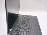 a laptop computer that is open on a white surface