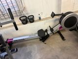 a rowing machine that is sitting in a garage