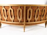 a wooden bench that is on a white surface