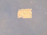 a blue book with a yellow label on it