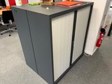 a cabinet that has a box on top of it