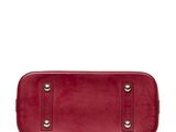 a red leather purse with two compartments on a white background
