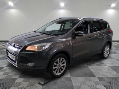the gray ford escape is parked on a checkered tile floor