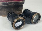two binoculars sitting next to each other on a table