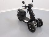 a scooter that is parked in a room