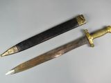 two different types of knives on a white surface