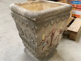 a planter that is sitting on the floor in a warehouse