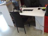 a desk with a computer and a printer on it