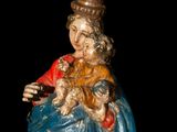 an image of a statue of a woman holding a child