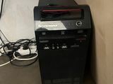 a computer tower with a keyboard and mouse on top of it