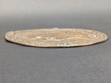 an image of a silver coin on a table