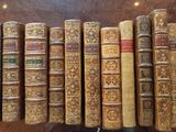 many old books lined up on a shelf