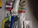 supplies laid out on a table including scissors, thread, scissors, and other items