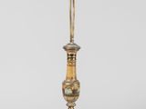 an old fashioned lamp with a gold base and a white base