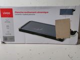 emballage d'une boîte sur laquelle figure l'image d'un ordinateur portable