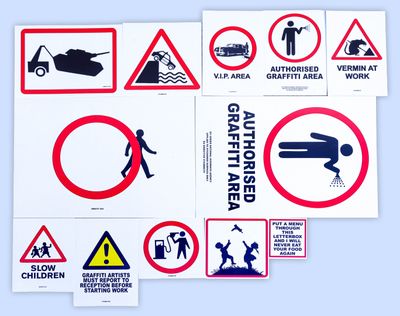various signs and stickers on a blue surface with a white background