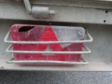 a red container on the back of a truck