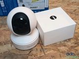 a close up of a camera sitting on top of a box on a table