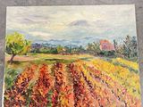 a painting of a field with a tree and mountains in the background