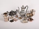 a lot of silver items that are on a table