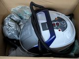 a box with a vacuum and other items inside of it