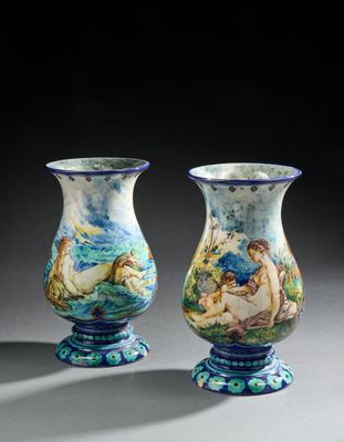 pair of blue and white vases with figures painted on them