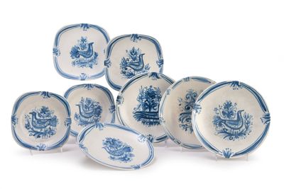 six blue and white plates with blue flowers on them on a white surface