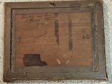 a picture of a picture of a piece of wood with writing on it