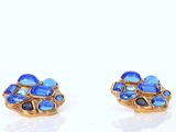 pair of blue glass and goldtone earrings on a white background