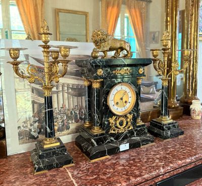 a picture of a clock on a table in a room