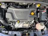 the engine of a car with its hood open and the hood down