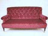 an image of a red couch against a white background