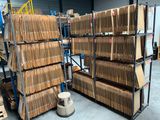 a large amount of boxes stacked on a rack in a warehouse