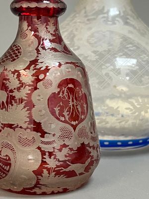 two vases sitting next to each other on a table