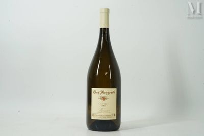 a bottle of wine that is sitting on a table