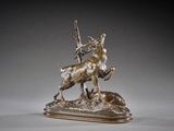 bronze statue of a man on a horse with a bird on its back