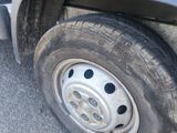 a close up of a tire on the side of a truck